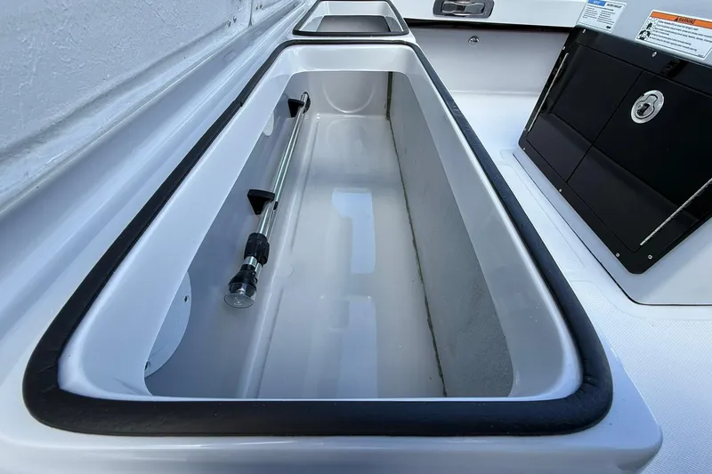 Slide: The Image of 2026 Action Craft 20 FLATSMASTER boat storage compartment with hydraulic support. - 11