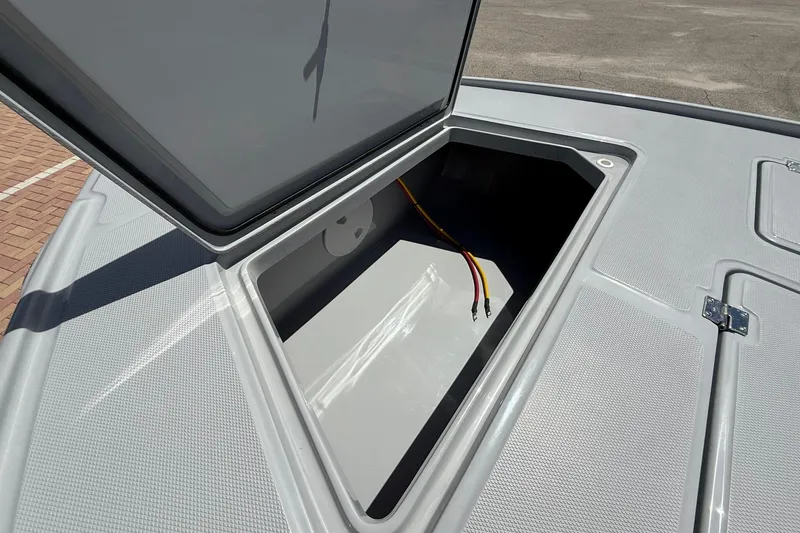 Slide: The Image of Open storage compartment on 2026 Action Craft 20 Flatsmaster boat deck. - 28