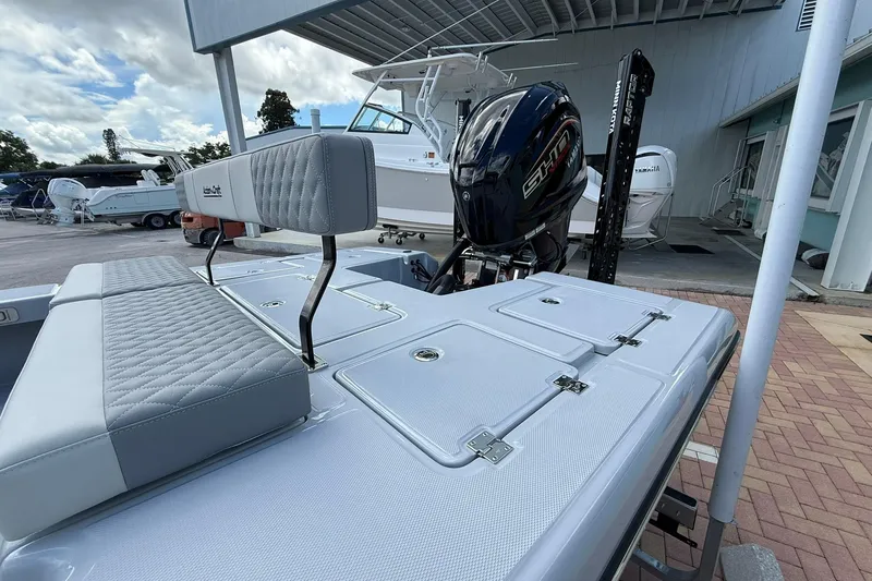 Slide: The Image of 2026 Action Craft 20 FLATSMASTER boat with Yamaha engine, docked outdoors. - 5