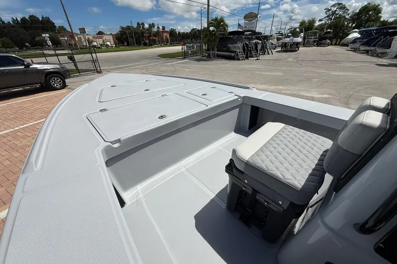 Slide: The Image of 2026 Action Craft 20 Flatsmaster boat interior with seating and storage compartments. - 23