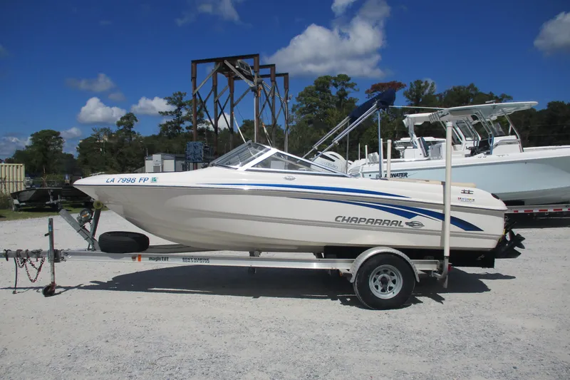 The Image of 2007 CHAPARALL 180 boat on trailer under clear blue sky. - 0