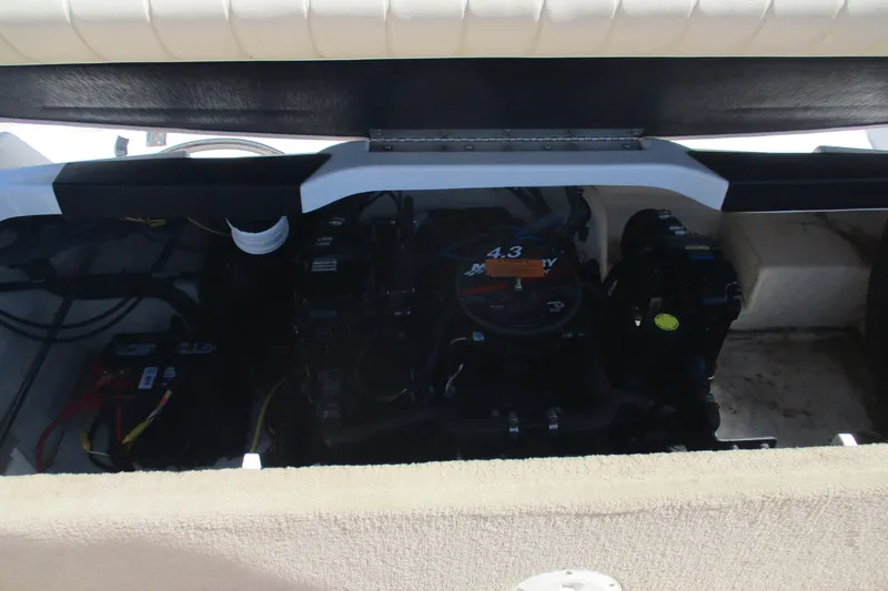 Slide: The Image of Engine compartment of a 2007 CHAPARALL 180 boat, featuring a 4.3 Mercury engine. - 11