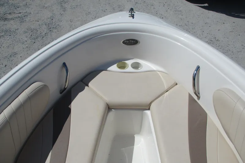 Slide: The Image of 2007 CHAPARALL 180 boat interior with beige seating and stainless steel handles. - 5