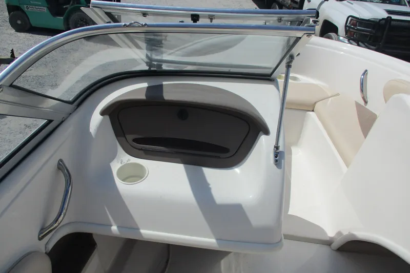 Slide: The Image of 2007 CHAPARALL 180 boat interior with windshield, seating, and storage compartment. - 8