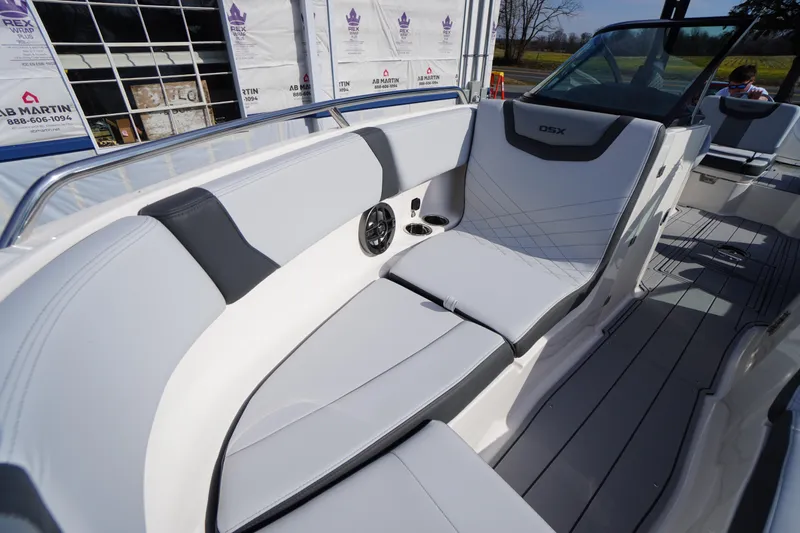 Slide: The Image of 2026 Chaparral 250 OSX boat interior with sleek seating and modern design. - 10