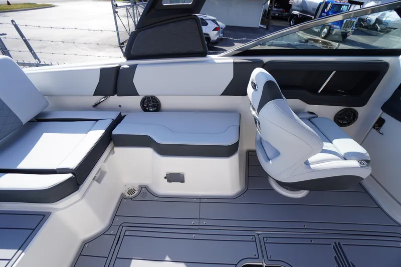 Slide: The Image of 2026 Chaparral 250 OSX boat interior with modern seating and sleek design. - 29