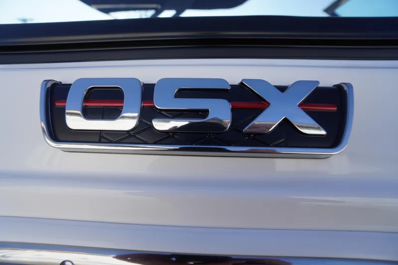 Slide: The Image of 2026 Chaparral 250 OSX emblem with chrome finish and red accent. - 3