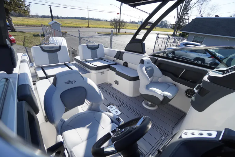 Slide: The Image of 2026 Chaparral 250 OSX boat interior with modern seating and sleek design. - 31