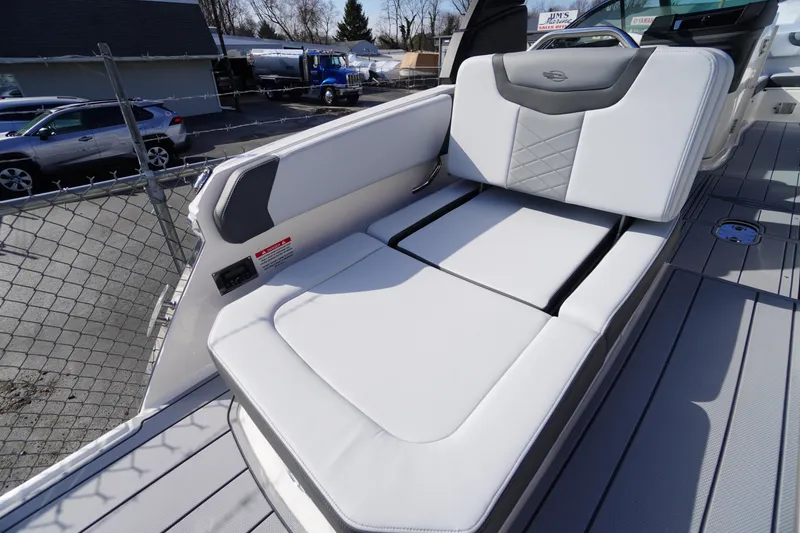 Slide: The Image of 2026 Chaparral 250 OSX boat with luxurious white seating and modern design. - 37