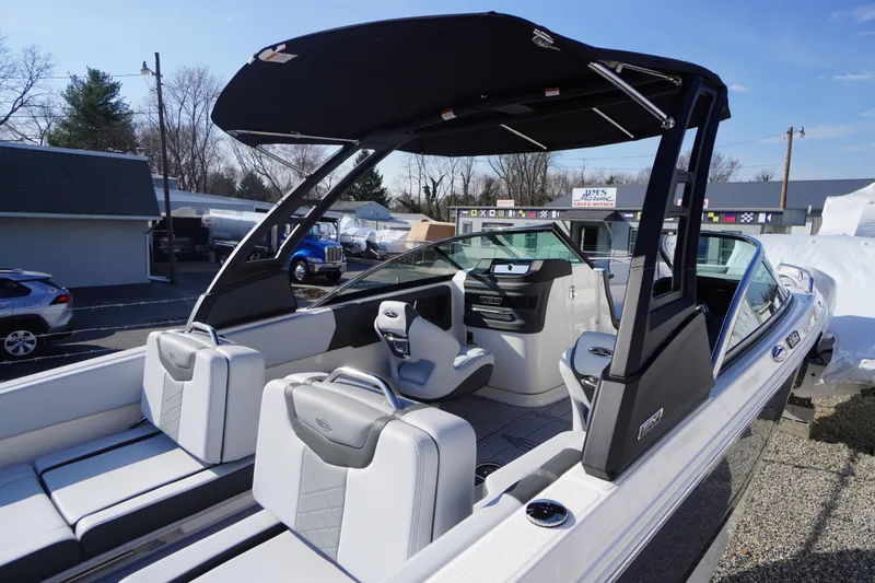 Slide: The Image of 2026 Chaparral 250 OSX boat interior with sleek seating and modern design. - 40