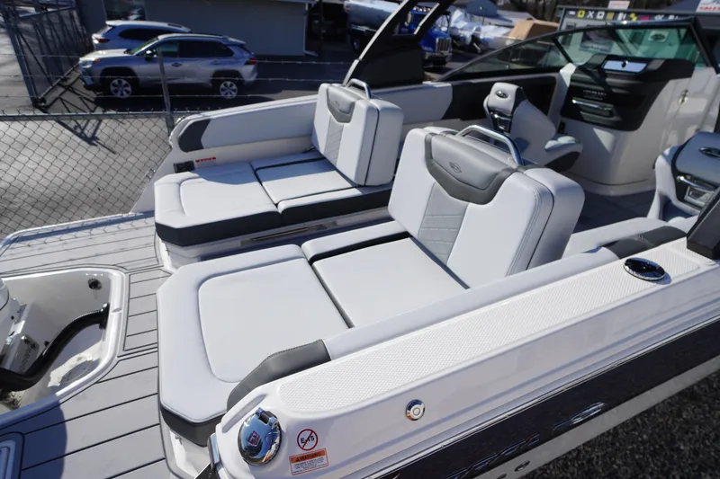 Slide: The Image of 2026 Chaparral 250 OSX boat interior with luxurious seating and modern design. - 41