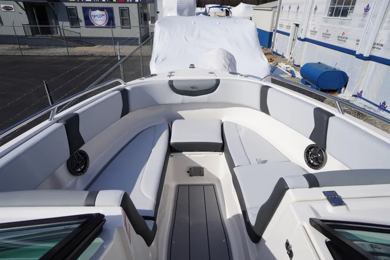 Slide: The Image of 2026 Chaparral 250 OSX boat interior with sleek seating and modern design. - 7