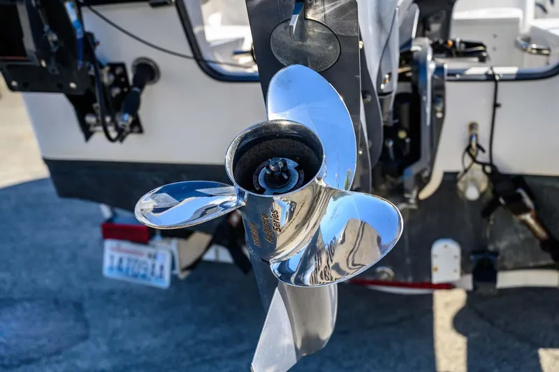 Slide: The Image of Close-up of a 2016 Edgewater 188CC boat propeller, shiny and metallic. - 15