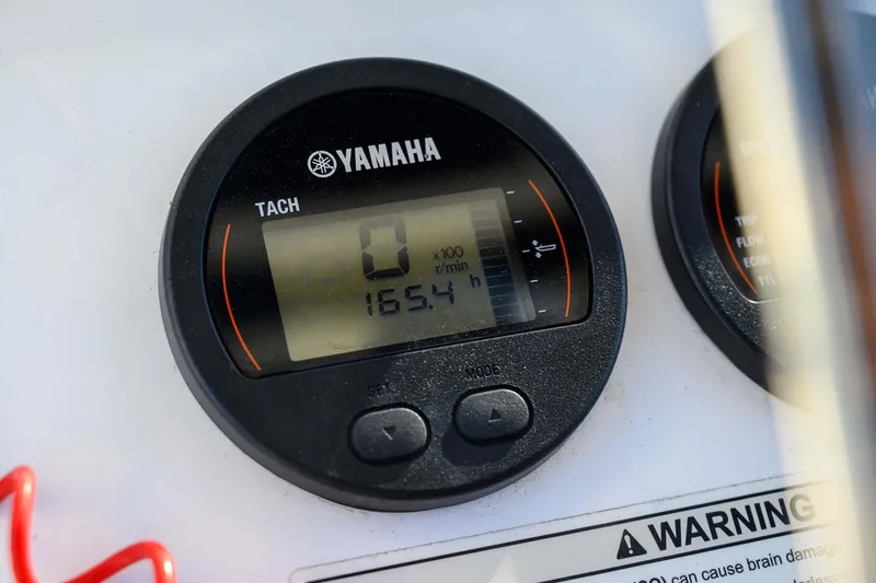 Slide: The Image of Yamaha tachometer on 2016 Edgewater 188CC boat, displaying 165.4 hours. - 16