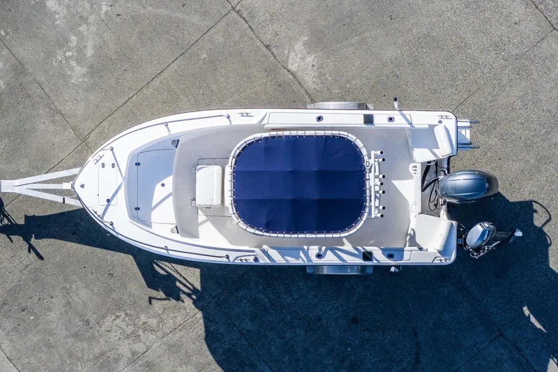 Slide: The Image of Aerial view of 2016 Edgewater 188CC boat on trailer, featuring blue seating. - 5