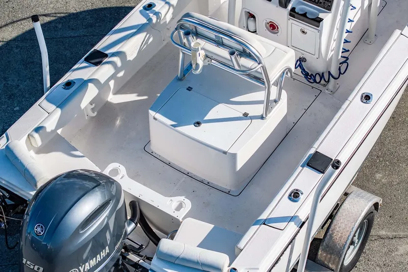 Slide: The Image of 2016 Edgewater 188CC boat interior with Yamaha engine, featuring seating and control console. - 9