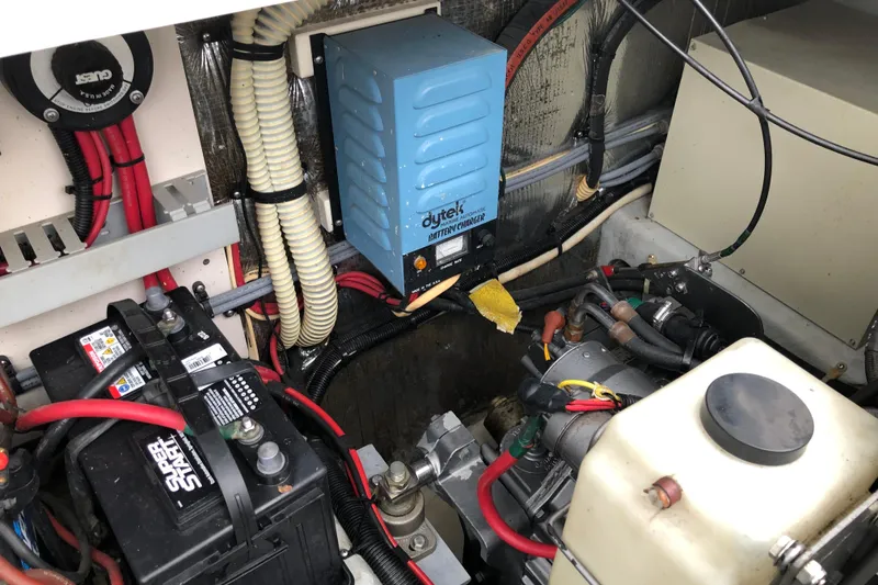 Slide: The Image of Engine compartment of a 1994 Mainship 31 Sedan Bridge with battery and wiring. - 19