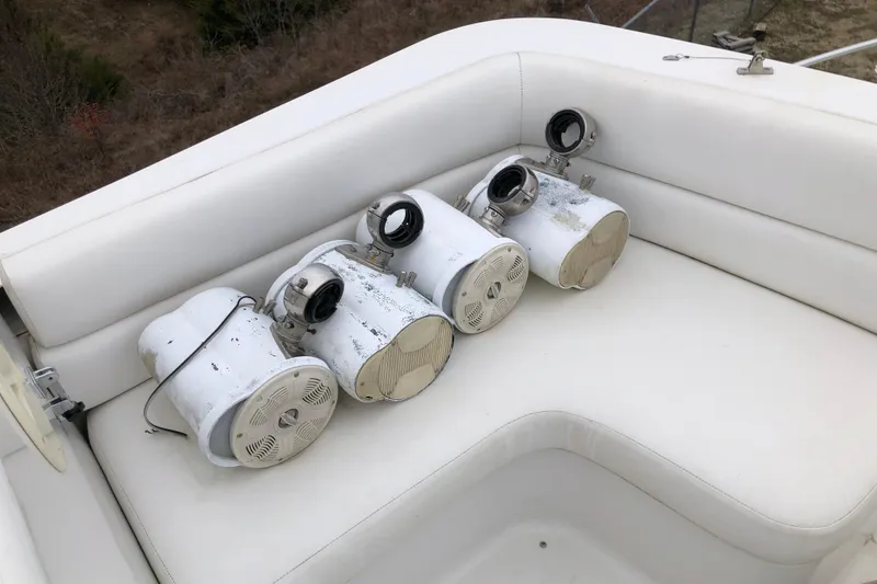 Slide: The Image of Four white marine spotlights on a 1994 Mainship 31 Sedan Bridge boat seat. - 5