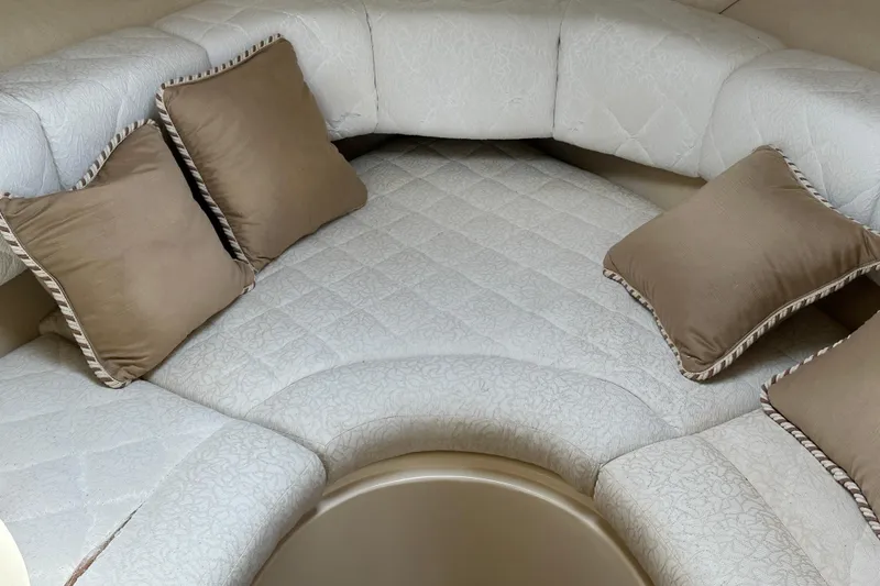 Slide: The Image of Luxurious interior seating of 2001 Sea Ray 270 Sundancer with beige cushions. - 15