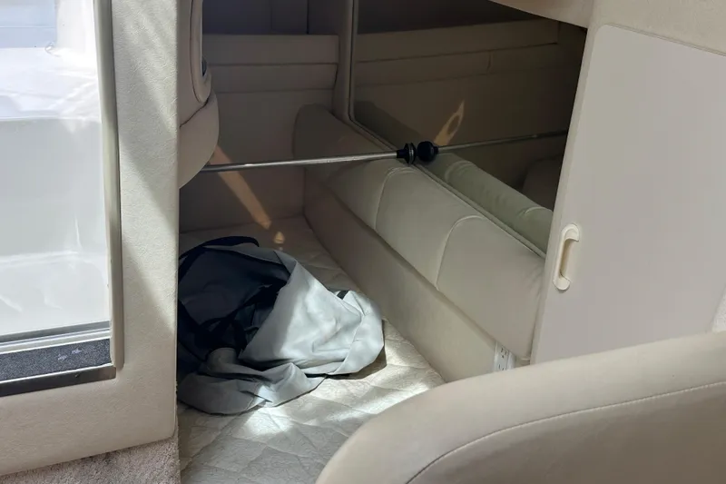 Slide: The Image of Interior cabin of 2001 Sea Ray 270 Sundancer with beige upholstery. - 19