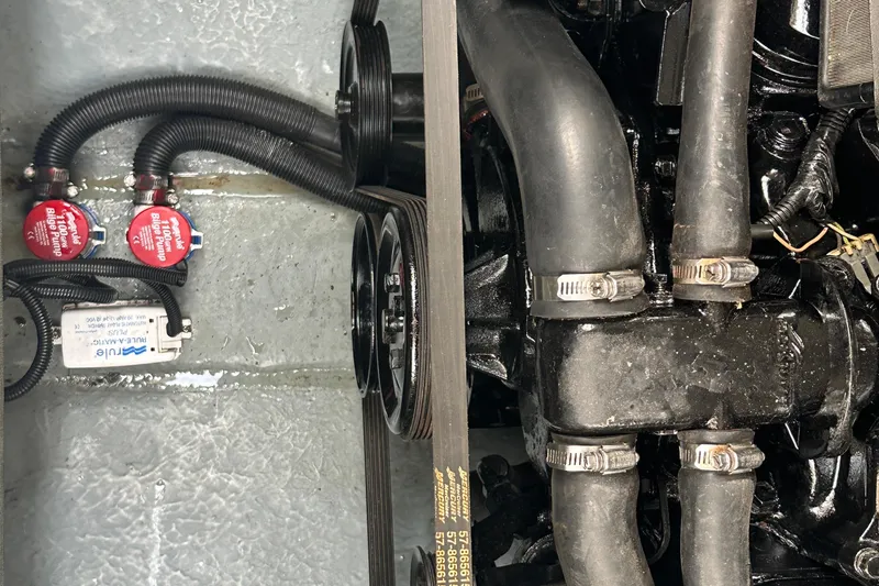 Slide: The Image of Engine compartment of a 2001 Sea Ray 270 Sundancer with bilge pumps and hoses. - 22