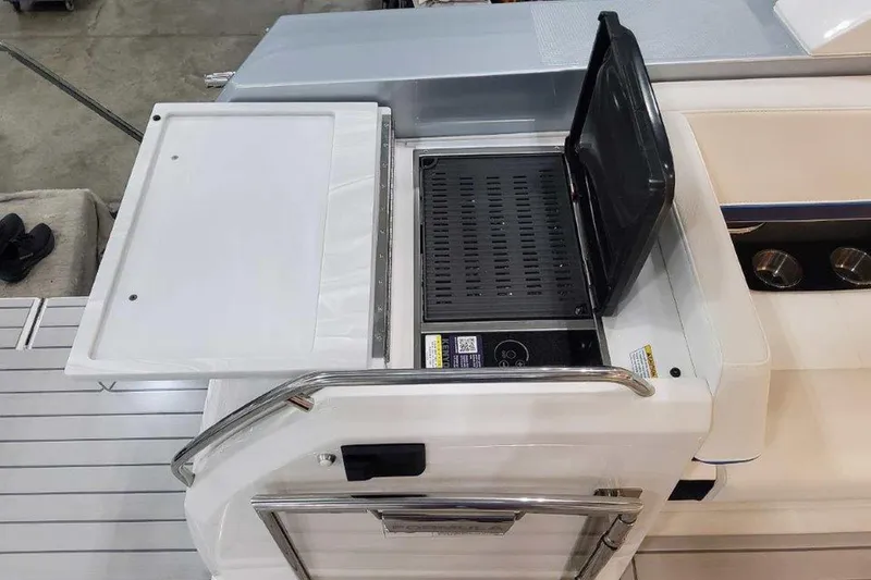 Slide: The Image of 2026 Formula 400 Super Sport Crossover interior with sleek kitchenette and modern amenities. - 13