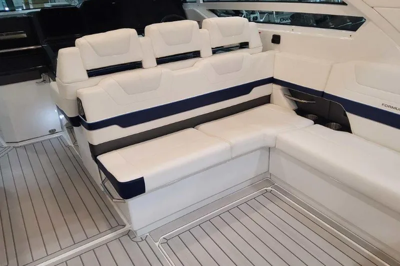 Slide: The Image of 2026 Formula 400 Super Sport Crossover boat interior with open storage compartment. - 18