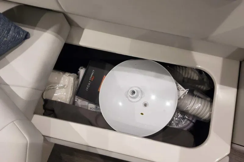 Slide: The Image of 2026 Formula 400 Super Sport Crossover boat interior with sleek seating and dual tables. - 26