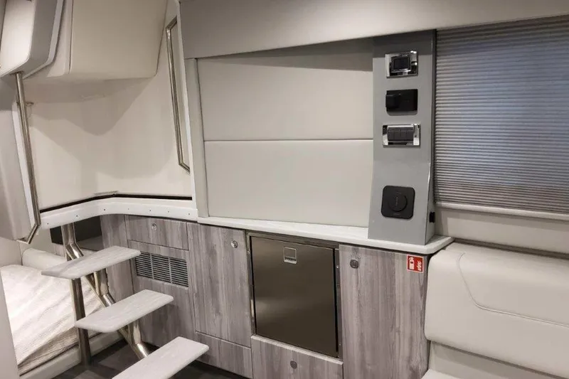 Slide: The Image of 2026 Formula 400 Super Sport Crossover interior storage compartment with black fabric inside. - 28