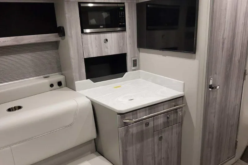 Slide: The Image of 2026 Formula 400 Super Sport Crossover boat interior with open storage compartment. - 29