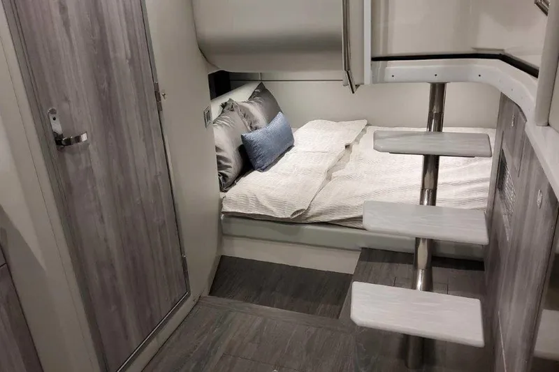 Slide: The Image of Interior view of 2026 Formula 400 Super Sport Crossover, featuring elegant seating and wood flooring. - 31