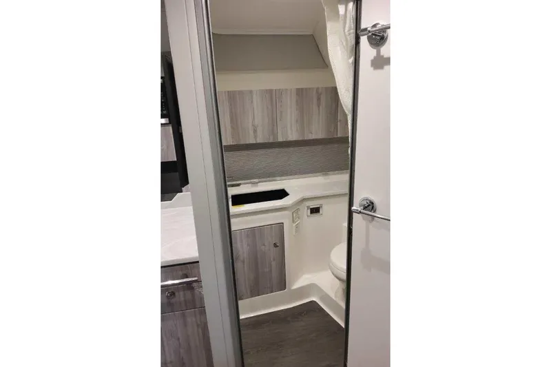 Slide: The Image of Interior seating area of 2026 Formula 400 Super Sport Crossover with modern cushions and wood flooring. - 34