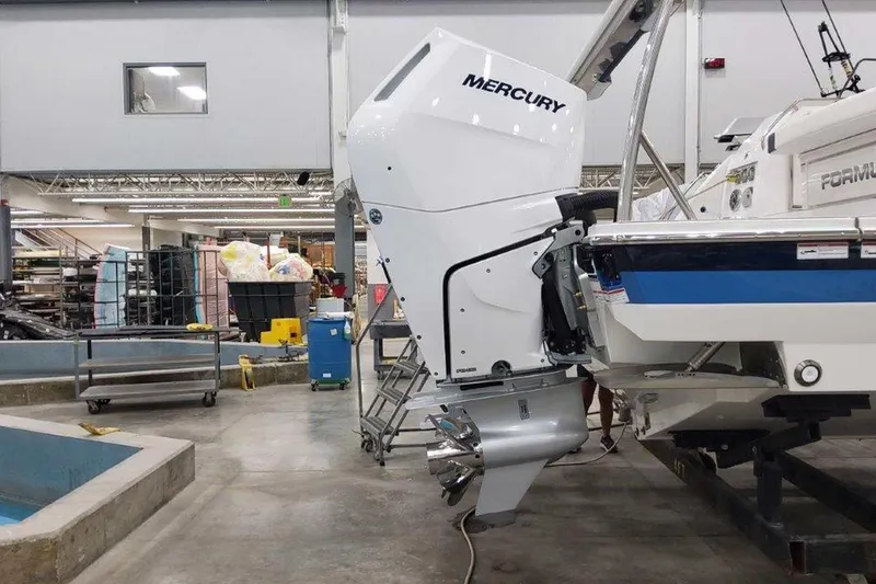 Slide: The Image of 2026 Formula 400 Super Sport Crossover with four powerful outboard engines in a workshop. - 4