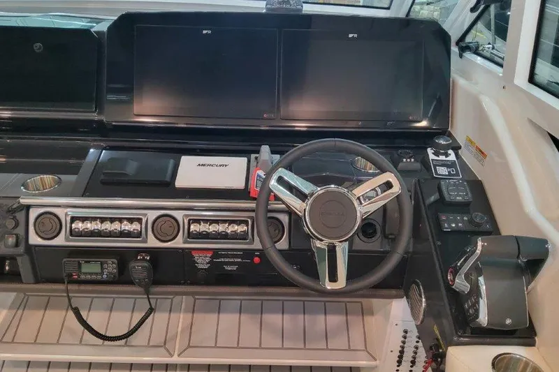 Slide: The Image of Engine compartment of 2026 Formula 400 Super Sport Crossover, showcasing batteries and mechanical components. - 44