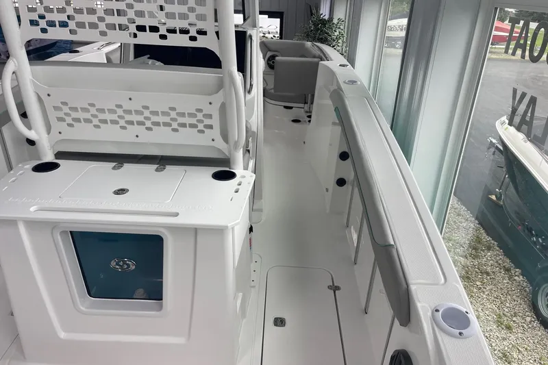 Slide: The Image of 2026 Hurricane Center Console 24 OB boat interior with seating and storage features. - 11