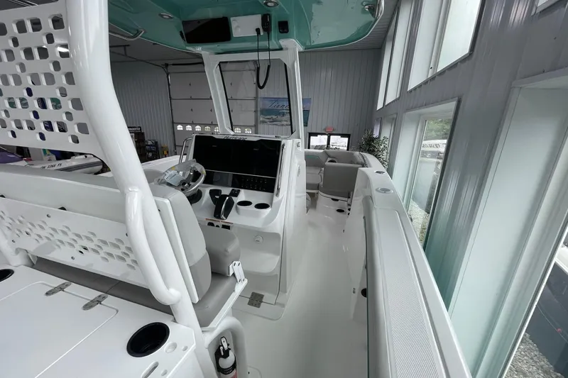 Slide: The Image of 2026 Hurricane Center Console 24 OB boat interior with modern helm and seating. - 14