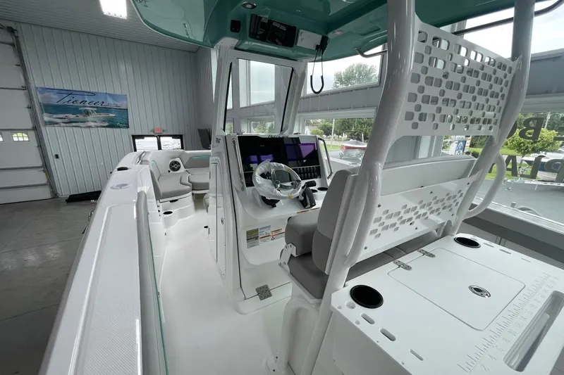 Slide: The Image of 2026 Hurricane Center Console 24 OB boat interior with modern helm and seating. - 15