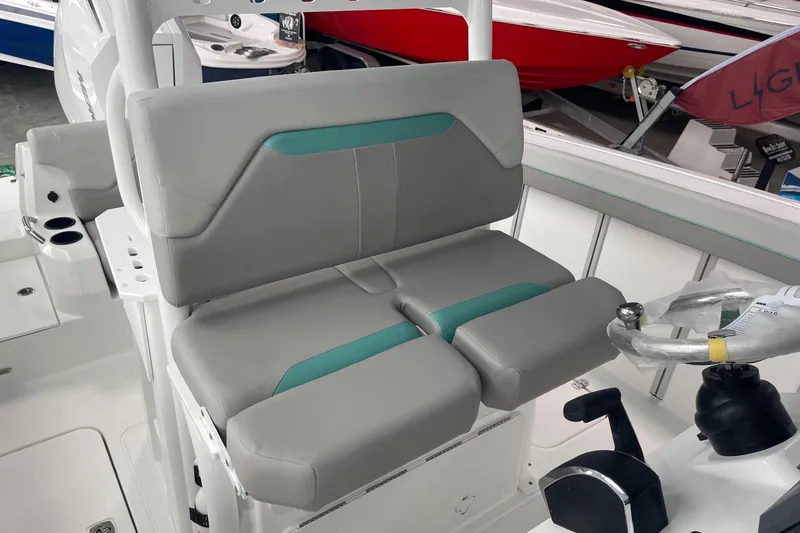 Slide: The Image of 2026 Hurricane Center Console 24 OB boat interior with gray and teal seating. - 20