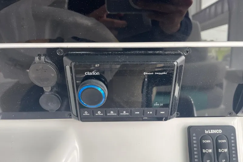 Slide: The Image of Control panel of 2026 Hurricane Center Console 24 OB with Clarion audio system. - 26