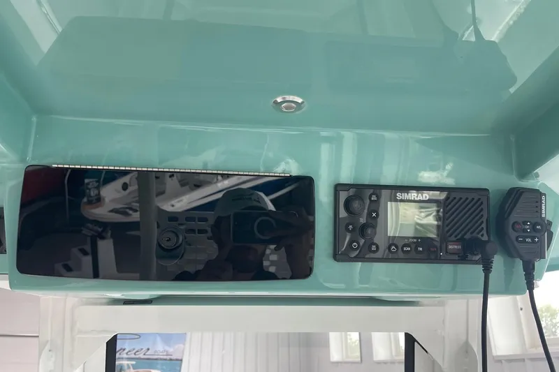 Slide: The Image of 2026 Hurricane Center Console 24 OB dashboard with Simrad marine electronics. - 29