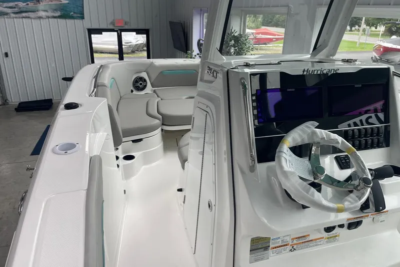 Slide: The Image of 2026 Hurricane Center Console 24 OB boat interior with modern helm and seating. - 36