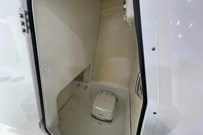 Slide: The Image of Interior of 2026 Hurricane Center Console 24 OB boat with compact toilet. - 38