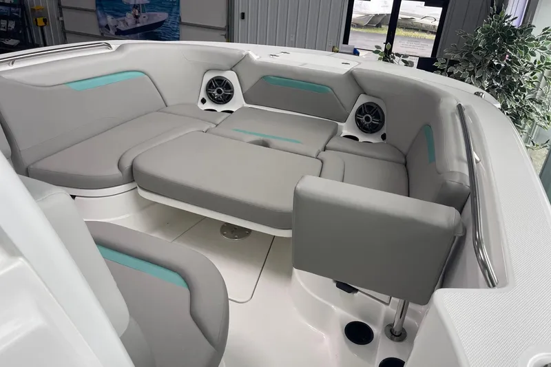 Slide: The Image of Luxurious seating area on 2026 Hurricane Center Console 24 OB boat, featuring modern design and speakers. - 41