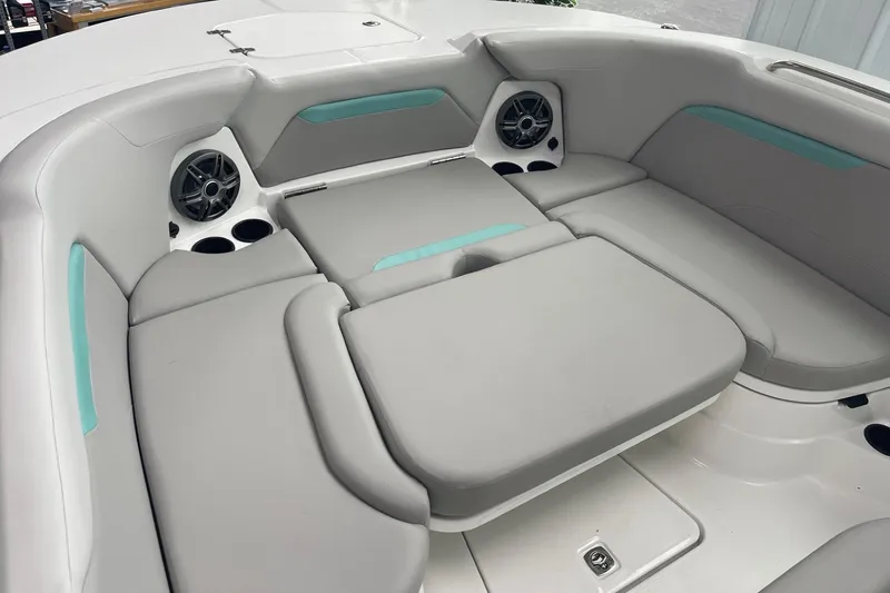Slide: The Image of 2026 Hurricane Center Console 24 OB boat interior with cushioned seating and built-in speakers. - 43