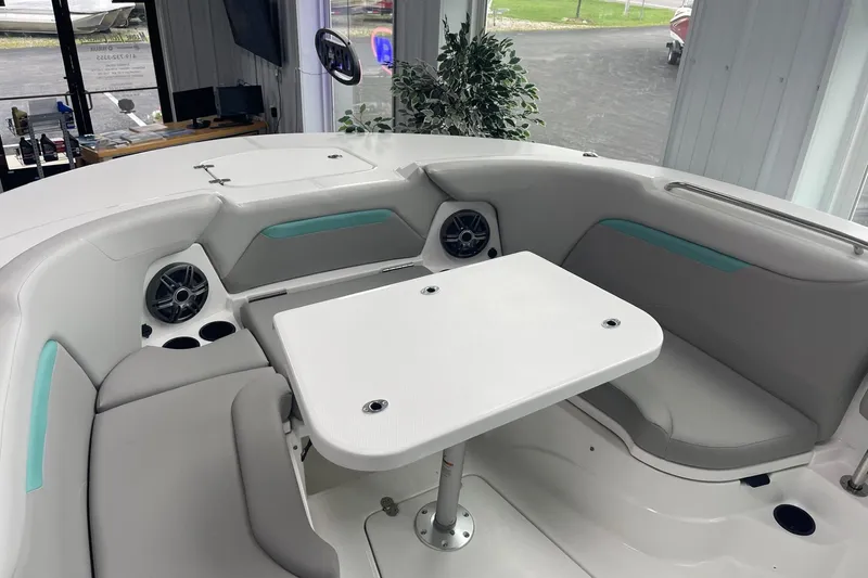 Slide: The Image of 2026 Hurricane Center Console 24 OB boat interior with seating and table, featuring modern design. - 48
