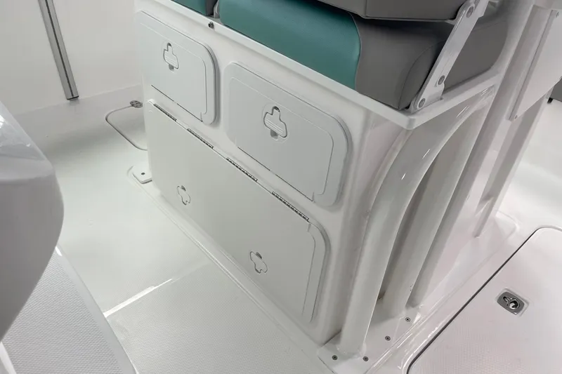 Slide: The Image of 2026 Hurricane Center Console 24 OB boat interior with storage compartments and cushioned seating. - 52