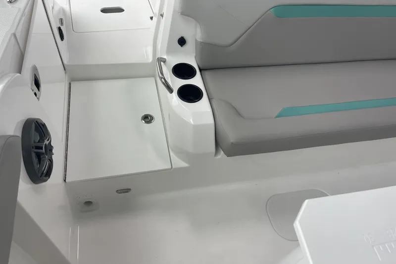 Slide: The Image of 2026 Hurricane Center Console 24 OB interior with seating and cup holders. - 54