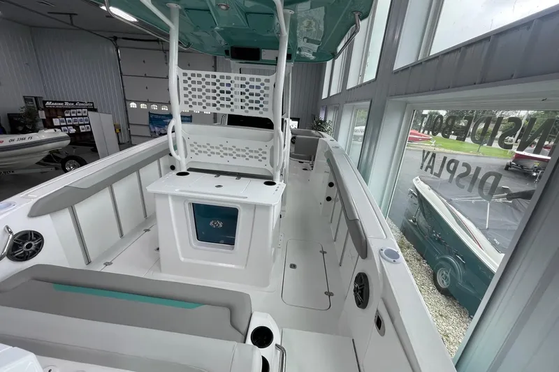 Slide: The Image of 2026 Hurricane Center Console 24 OB boat interior, featuring spacious seating and modern design. - 9