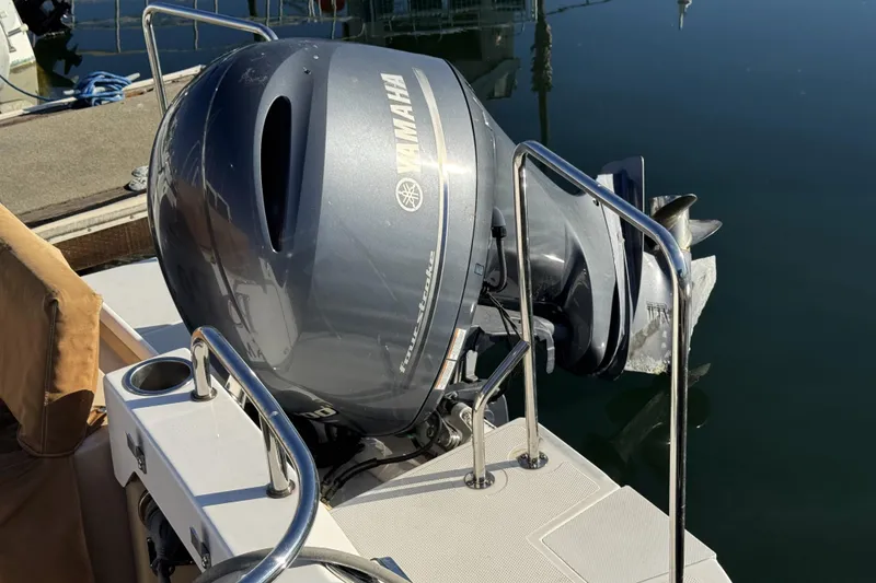 Slide: The Image of 2019 Ranger Tugs R-23 with Yamaha outboard motor at dock. - 13