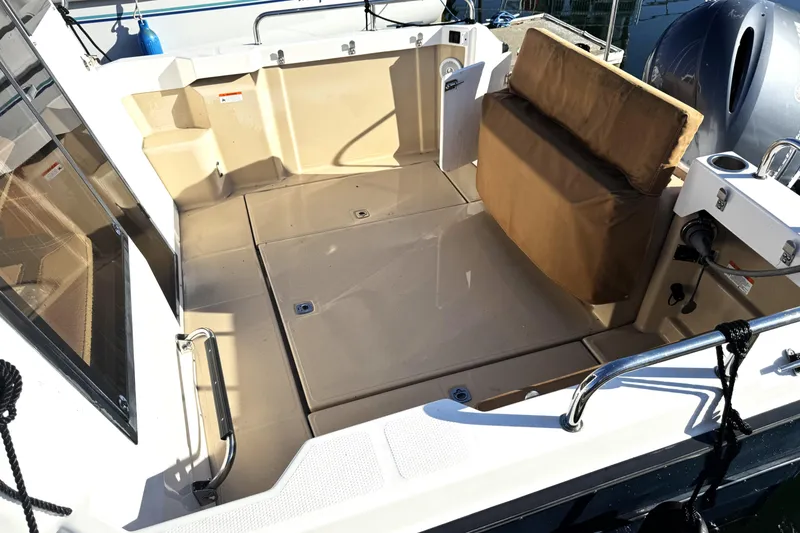 Slide: The Image of 2019 Ranger Tugs R-23 boat cockpit with seating and storage. - 3